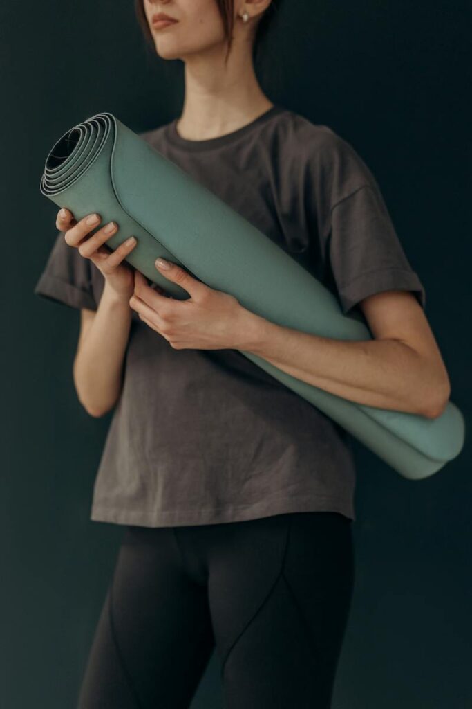 Crop Photo Of Woman With Yoga Mat