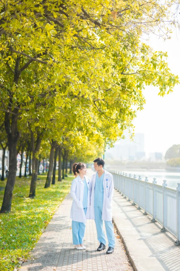 a couple of people that are walking down a sidewalk